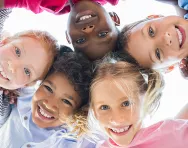 Children in a circle smiling Children in a circle smiling