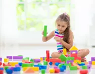Girl playing with building blocks