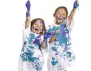 Boy and girl covered in paint Boy and girl covered in paint