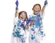 Boy and girl covered in paint