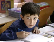 Boy writing at desk