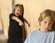 Boy making fun of this brother