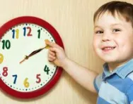 Boy playing with clock Boy playing with clock