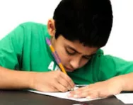 Boy writing at desk Boy writing at desk