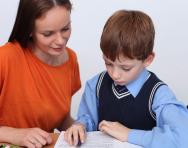 Child and tutor working together