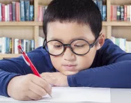 Child handwriting with a pen