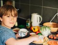 Healthy risks to take with kids Child making a sandwich