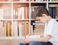 Child reading in a library