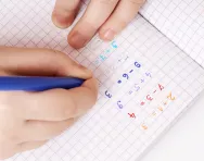 Child solving addition problems - partitioning