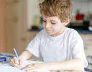 Child writing at home