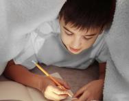 Child writing in diary
