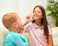 Children learning sign language