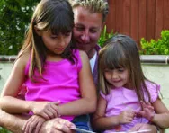 Dad reading to sisters Dad reading to sisters