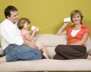Family playing with fake phone