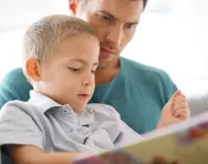 Father and son reading