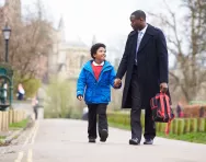 Father and son walking to school Father and son walking to school