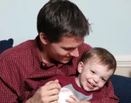 Father laughing with son