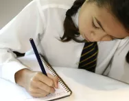 Girl doing times tables homework