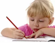 Girl practising handwriting Girl practising handwriting