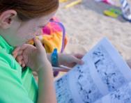 Girl reading on the beach