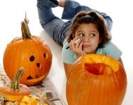 Girl with Halloween pumpkins