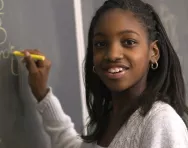 Girl writing on blackboard Girl writing on blackboard