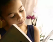 Happy girl reading book
