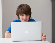 Boy looking at computer Boy looking at computer