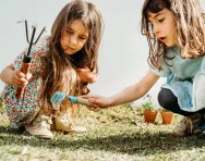 Two girls gardening with tools Two girls gardening with tools
