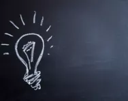Light bulb on blackboard Light bulb on blackboard