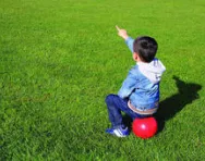 Little boy pointing at nothing