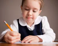 Little girl concentrating on her work Little girl concentrating on her work