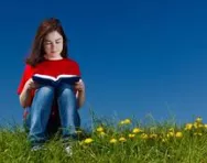 Little girl reading outside Little girl reading outside