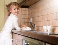 Little girl washing up