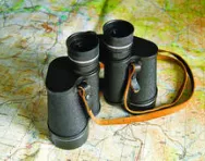Map and binoculars Map and binoculars