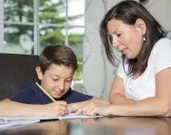 Mother and son doing homework