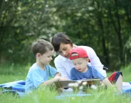 Children reading with mum