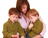 Mother reading with kids