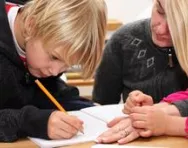 Mum helping child with work