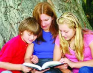 Mum reading to son and daughter Mum reading to son and daughter