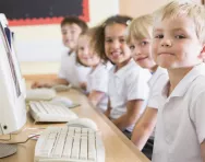 Primary-school children using computers Primary-school children using computers