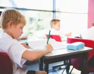 Schoolboy studying in classroom Schoolboy studying in classroom