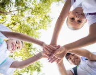 Schoolchildren stacking hands Schoolchildren stacking hands