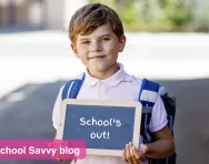 School child holding chalkboard School child holding chalkboard