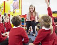 Teacher-children RE discussion in classroom