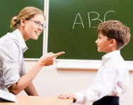 Teacher talking to child