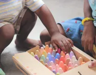 Child picking crayons Tina Floersch unsplash Child picking crayons Tina Floersch unsplash