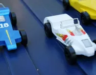 Toy cars going down a slope Toy cars going down a slope