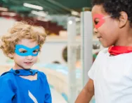 Two boys playing in costume Children in cheap, easy costumes