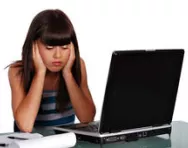 Upset girl at laptop